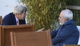 U.S. Secretary of State John Kerry, left, talks with Iranian Foreign Minister Mohammad Javad Zarif, in Geneva, Switzerland, Saturday, May 30, 2015.  Top U.S. and Iranian diplomats are gathering in Geneva this weekend, hoping to bridge differences over a nuclear inspection accord and economic sanctions on Tehran. (AP Photo/Susan Walsh, Pool)