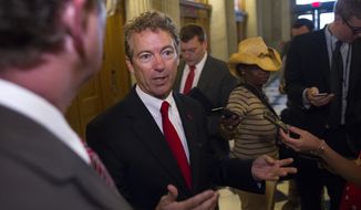 Sen. Rand Paul, R-Ky., talks with reporters outside of the Senate Chamber following his address to the Senate in Washington, Sunday, May 31, 2015. (AP Photo/Cliff Owen) ** FILE **