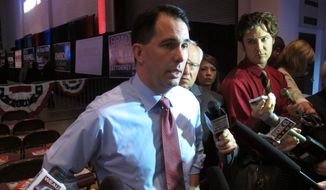 A Washington Times story about top Republicans such as Wisconsin Gov. Scott Walker skipping the Iowa straw poll triggered a move by Craig Williams, a member of the state party&#39;s central committee, to rally to save the poll. (Associated Press)