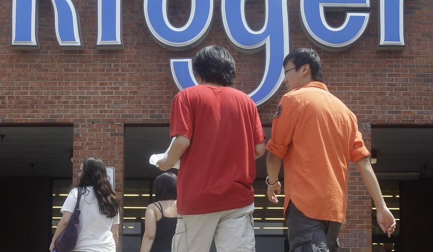 FILE - In this June 10, 2011 file photo, customers walk into a Kroger grocery store, in Cincinnati. Grocery giant Kroger Co. and Ohio officials on Monday, June 1, 2015 announced plans to bring nearly 650 jobs to new centers in Blue Ash, Ohio. (AP Photo/Al Behrman, File)