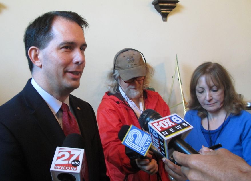 Gov. Scott Walker says he will sign a 20-week abortion ban regardless of whether there is an exemption for cases of rape or incest on Monday, June 1, 2015, in Delavan, Wis. (AP Photo/Scott Bauer)
