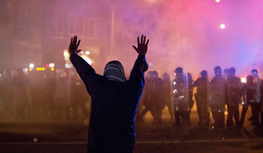 Baltimore erupted in violent face-offs with police during rioting this spring. The city is hoping federal taxpayers will help cover the costs of police, firefighters and other first responders, and the damage to city-owned property, which is estimated at $20 million. (Associated Press) ** FILE **
