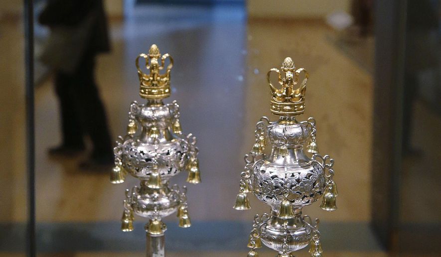 Ceremonial bells belonging to the 250-year-old Touro Synagogue in Newport, R.I., and worth more than $7 million are seen on display at the Museum of Fine Arts in Boston, Monday, June 1, 2015. The fate of the bells and the nation's oldest synagogue to which they belong is in the hands of a Rhode Island court which will decide on a dispute between the congregation that currently worships at the Touro Synagogue and the nation's first Jewish congregation, Shearith Israel, of New York. The disagreement began over the proposed sale to a museum of ceremonial bells for $7.4 million and has become a bitter dispute over who is in charge of the 250-year-old Touro Synagogue in Newport. (AP Photo/Stephan Savoia)