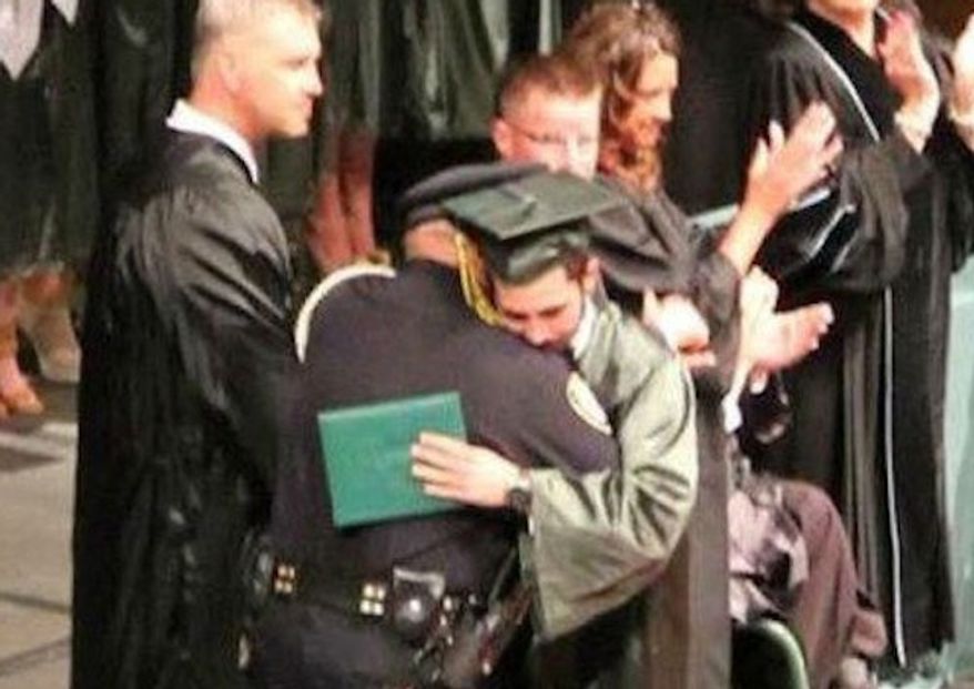Lt. Eric Ellison is being widely praised after he attended the graduation ceremony of 18-year-old Kazzie Portie, whose parents were killed by a drunk driver less than a week earlier. (12 News/Lindsey Stanley Frugal)
