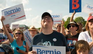Happy fans cheer while Sen. Bernie Sanders speaks in Burlington, Vermont. (associated press)
