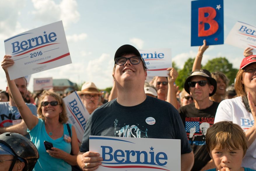 Happy fans cheer while Sen. Bernie Sanders speaks in Burlington, Vermont. (associated press)