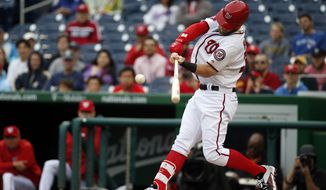 Washington Nationals&#39; Bryce Harper hits an RBI single during the fifth inning of the first baseball game in a doubleheader against the Toronto Blue Jays, Tuesday, June 2, 2015 in Washington. (AP Photo/Alex Brandon)
