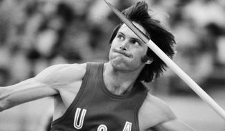 FILE  - In this July 30, 1976, file photo, Bruce Jenner, of the United States, throws the the javelin during the decathlon competition at the Olympics in Montreal, Canada. Mr. Jenner made his debut as a transgender woman on the cover for the July 2015 issue of Vanity Fair.  (AP Photo/File)