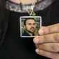 Naghmeh Abedini, holds a necklace with a photograph of her husband, Saeed Abedini, on Capitol Hill in Washington, Tuesday, June 2, 2015, during a House Foreign Affairs Committee hearing with four people whose family members are being held in Iran. (AP Photo/Jacquelyn Martin)