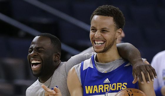 Golden State Warriors&#x27; Draymond Green, left, and Stephen Curry laugh during NBA basketball practice, Wednesday, June 3, 2015, in Oakland, Calif. The Warriors host the Cleveland Cavaliers in Game 1 of the NBA Finals on Thursday. (AP Photo/Ben Margot)
