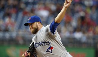 Toronto Blue Jays starting pitcher Mark Buehrle (56) throws during the first inning of a baseball game against the Washington Nationals at Nationals Park, Wednesday, June 3, 2015, in Washington. (AP Photo/Alex Brandon)