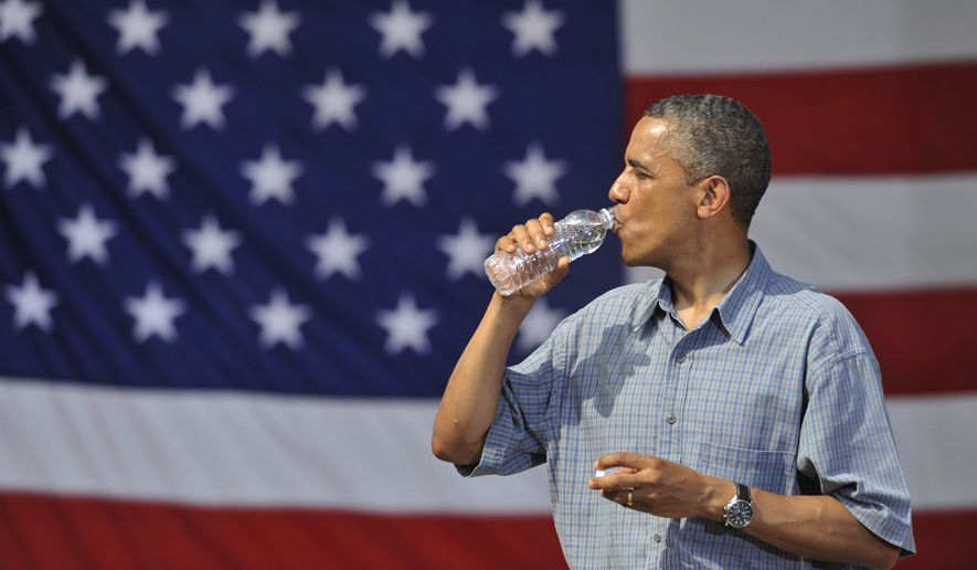 President Obama drinks from a bottle of water after his speech at Washington Park in Sandusky, Ohio, on July 5, 2012. Obama is on a two-day bus trip through Ohio and Pennsylvania. (Associated Press) **FILE**