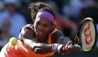 Serena Williams of the U.S. returns in her semifinal match of the French Open tennis tournament against Timea Bacsinszky of Switzerland at the Roland Garros stadium, in Paris, France, Thursday, June 4, 2015. Williams won in three sets 4-6, 6-3, 6-0. (AP Photo/Francois Mori)