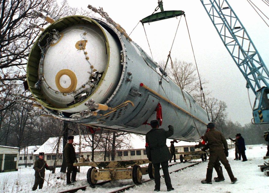 FILE - In this Dec. 24, 1997 file photo, soldiers prepare to destroy a ballistic SS-19 missile in the yard of the largest former Soviet military rocket base in Vakulenchuk, Ukraine. The Obama administration is weighing a range of aggressive responses to Russia’s alleged violation of a Cold War-era nuclear missile treaty, including deploying land-based missiles in Europe that could pre-emptively destroy the Russian weapons. This “counterforce” option is among possibilities the administration is discussing as it reviews its entire policy toward Russia in light of Moscow’s military intervention in Ukraine, its annexation of Crimea and other confrontational actions in Europe and beyond. The options go so far as one implied -- but not stated explicitly -- that would improve the ability of U.S. nuclear weapons to destroy military targets on Russian territory. (AP Photo, File)