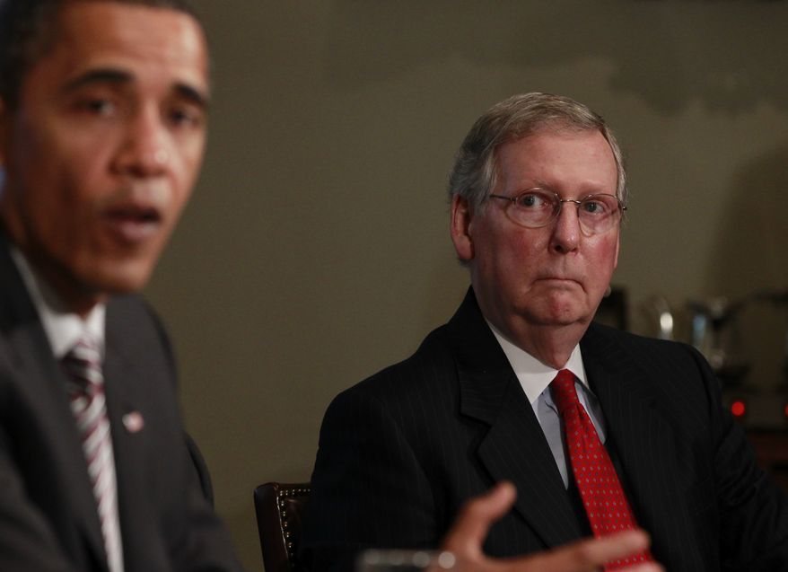 President Obama makes a statement to reporters as Senate Republican Leader Mitch McConnell of Kentucky looks on after a meeting regarding the BP Deepwater Horizon in the Cabinet Room at the White House in Washington on June 10, 2010. (Associated Press) **FILE**