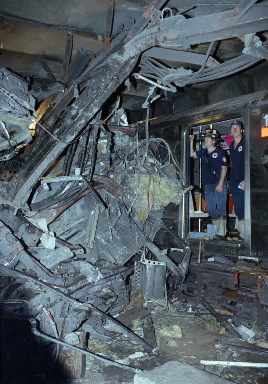 FILE - In this Aug. 28, 1991, file photo, firemen look at the twisted remains of a downtown Lexington Avenue 4 subway train after its derailment at Union Square in New York. Far removed from an era when New Yorkers knew him as the drunken motorman in a nightmarish subway crash, Robert Ray once again found himself in a miserable situation. This time, Ray was the victim, mowed down by a hit-and-run driver as he tried to cross a busy thoroughfare in the Bronx on May 28, 2015. (AP Photo/File)