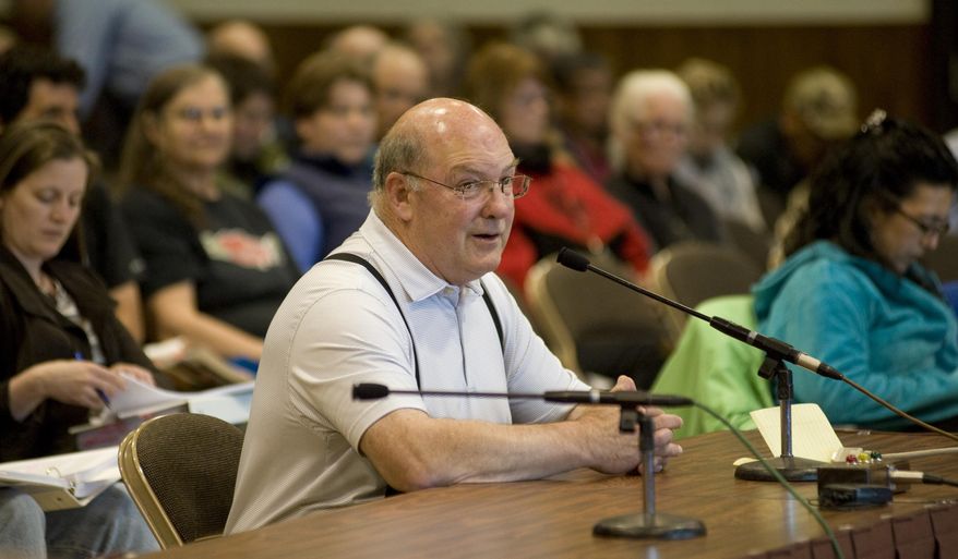 Larry Cotter, chief executive officer of Aleutian Pribilof Island Community Development Association, testifies at the North Pacific Fisheries Management Council meeting Friday, June 5,2015, in Sitka, Alaska, as the body considers reducing Bering Sea halibut bycatch limits. More than 130 people have signed up to give comments on the topic. Cotter is a former member of the council. (James Poulson/The Daily Sitka Sentinel via AP) MANDATORY CREDIT