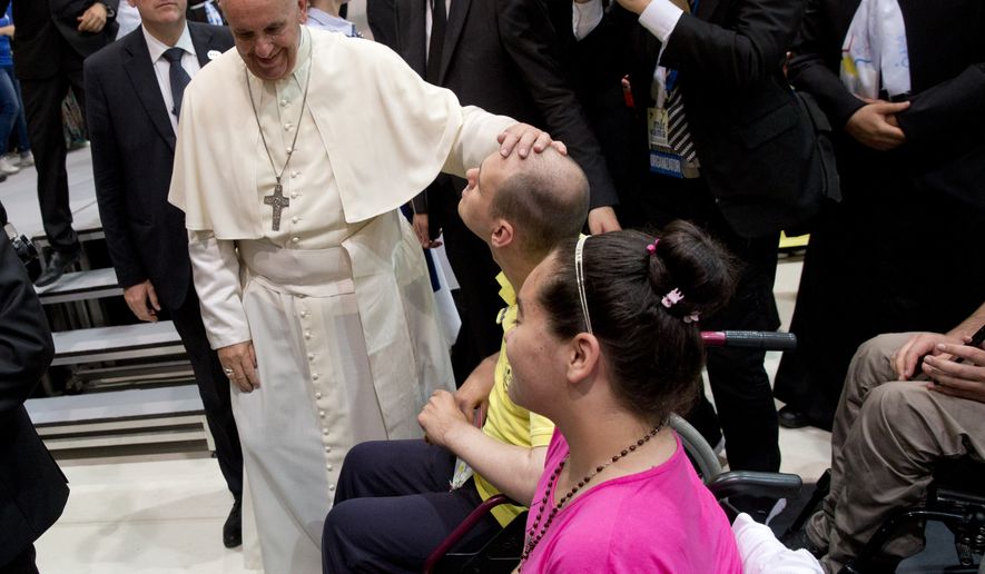 Pope Francis caresses a boy as he arrives at the John Paul II Diocesan Youth Center, in Sarajevo, Saturday, June 6, 2015. Pope Francis witnessed the horrors of Bosnia's fratricidal war of the 1990s and its slow process of healing Saturday during a one-day visit to Sarajevo, where he urged Muslims, Orthodox and Catholics to put the "barbarity" of the past behind them and work together for a peaceful future. (AP Photo/Andrew Medichini)