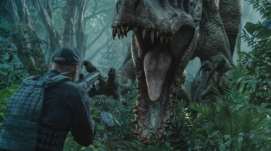 This photo provided by Universal Pictures shows, Indominus Rex about to attack in a scene from the film, "Jurassic World," directed by Colin Trevorrow, in the next installment of Steven Spielberg's groundbreaking "Jurassic Park" series. The Universal Pictures 3D movie releases in theaters on June 12, 2015. (ILM/Universal Pictures/Amblin Entertainment via AP)