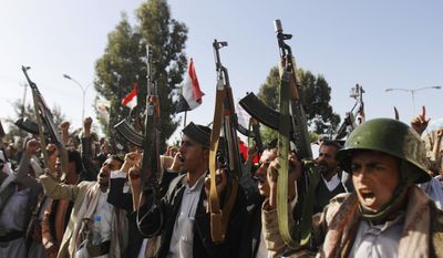 Shiite rebels, known as Houthis, chant slogans during a demonstration against an arms embargo imposed by the U.N. Security Council on Houthi leaders, in Sanaa, Yemen, April 16, 2015. (Associated Press) ** FILE **