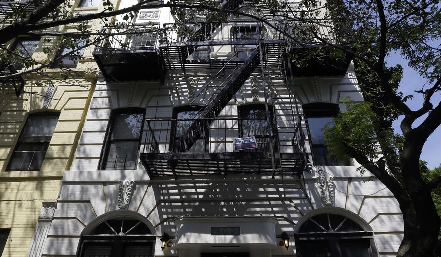 This Wednesday, June 3, 2015, photo, shows 309 East 8th Street in New York where “tenant relocation specialists” were hired to help the landlord buy residents out of rent-stabilized apartments that could become much more valuable if they leave. (AP Photo/Mary Altaffer)