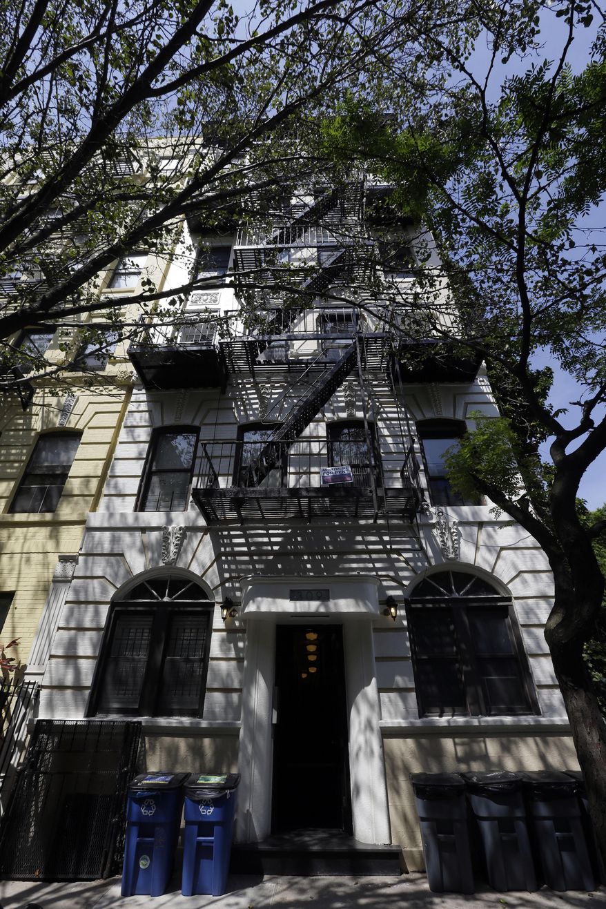 This Wednesday, June 3, 2015, photo, shows 309 East 8th Street in New York where “tenant relocation specialists” were hired to help the landlord buy residents out of rent-stabilized apartments that could become much more valuable if they leave. (AP Photo/Mary Altaffer)