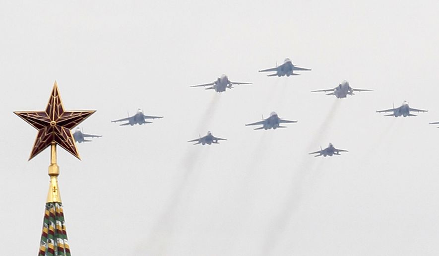 Russian army bombers fly over Grand Kremlin Palace during a Victory Parade rehearsal in Moscow. (Associated Press)