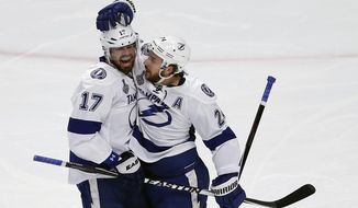 Tampa Bay Lightning&#39;s Ryan Callahan (right) is congratulated by teammate Alex Killorn after scoring during the first period Monday in Game 3 of the Stanley Cup Final against the Chicago Blackhawks. (Associated Press)