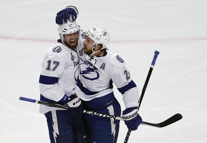 Tampa Bay Lightning&#x27;s Ryan Callahan (right) is congratulated by teammate Alex Killorn after scoring during the first period Monday in Game 3 of the Stanley Cup Final against the Chicago Blackhawks. (Associated Press)