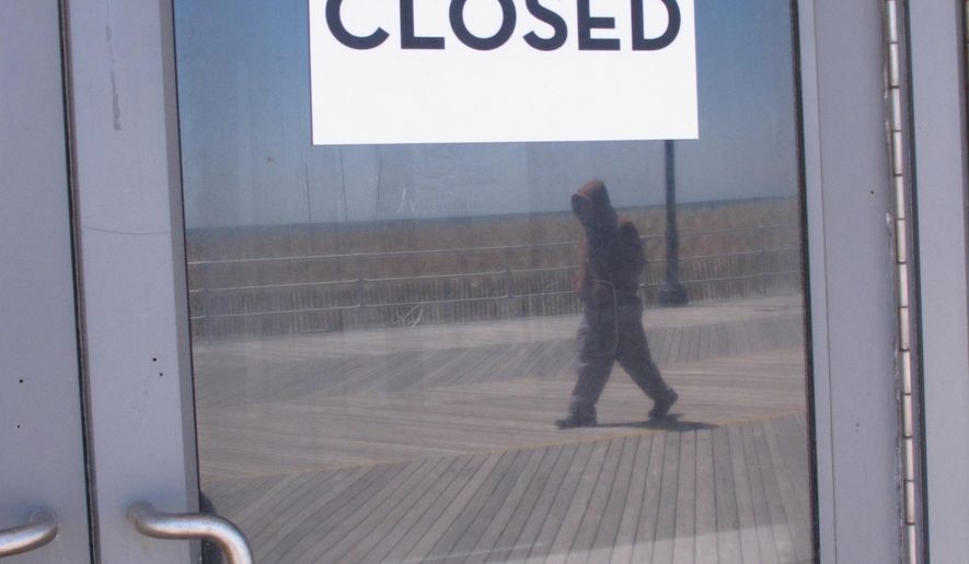 This April 24, 2015 photo shows a "closed" sign on a door of the former Revel casino on the Atlantic City, N.J. Boardwalk, one of four Atlantic City casinos to go out of business in 2014. Three New Jersey lawmakers introduced a bill on June 8, 2015 that would ask voters whether to approve two new casinos in the northern and central portions of the state. Voters would need to amend the state Constitution in a referendum to permit gambling outside Atlantic City. (AP Photo/Wayne Parry)