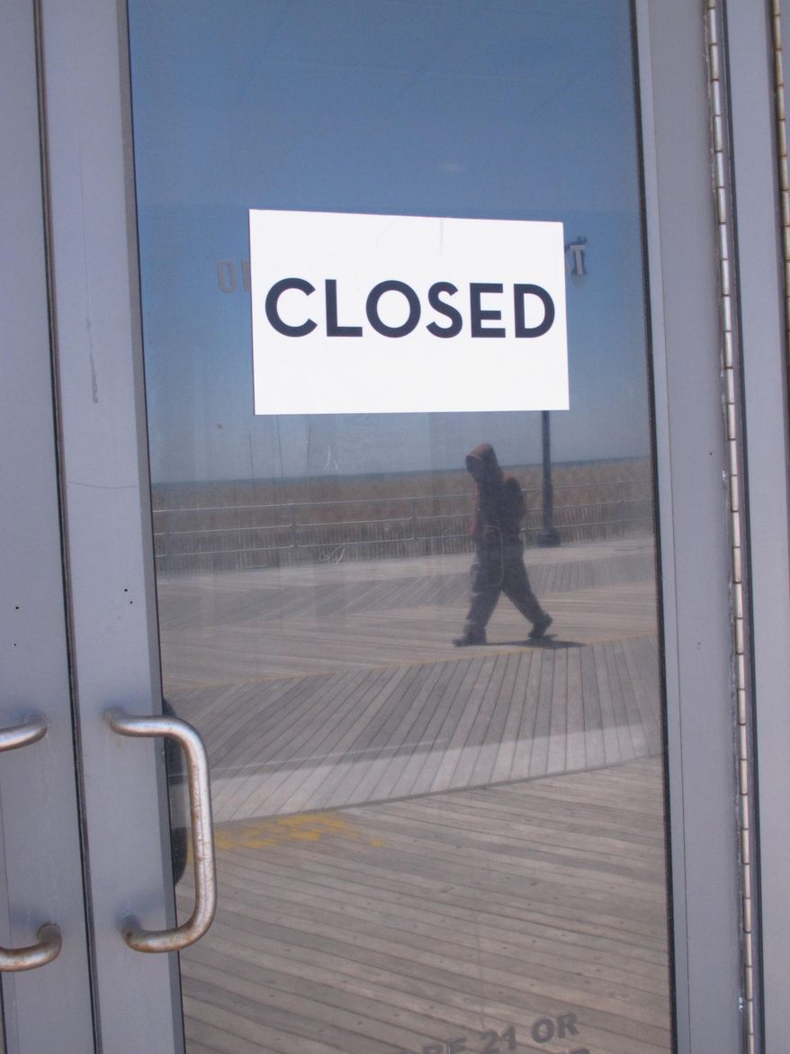 This April 24, 2015 photo shows a "closed" sign on a door of the former Revel casino on the Atlantic City, N.J. Boardwalk, one of four Atlantic City casinos to go out of business in 2014. Three New Jersey lawmakers introduced a bill on June 8, 2015 that would ask voters whether to approve two new casinos in the northern and central portions of the state. Voters would need to amend the state Constitution in a referendum to permit gambling outside Atlantic City. (AP Photo/Wayne Parry)