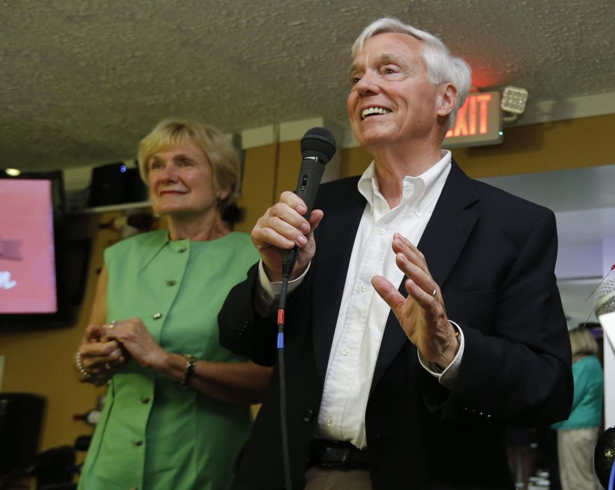 House Speaker William Howell, R-Stafford, right, speaks to supporters along with his wife, Cessie, during an election party in Fredericksburg, Va., Tuesday, June 9, 2015. Howell defeated the Tea Party's Susan Stimpson in Tuesday's primary. (AP Photo/Steve Helber)