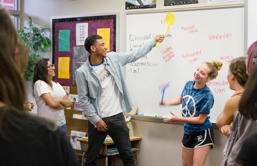 From left, Amy Sanchez, Tyrell Lopez, Nikki Thomas and Gabby Jonsson act during a college possible class at Papillion-La Vista High School, on June 2, 2015, in Omaha, Neb. The nonprofit College Possible worked with students in helping them learn about college majors, social life and professional communication. (Kent Sievers,The World-Herald via AP)