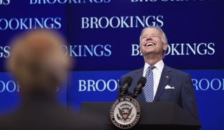 FILE - In this May 27, 2015 file photo, Vice President Joe Biden laughs as he is asked a question during his speech about the conflict in Ukraine at the Brookings Institute in Washington. Biden faces the daunting decision of how and when to re-enter public life after burying his 46-year-old son. On Wednesday, Biden returns to Washington for lunch with the president and a meeting with the Ukrainian leader, but he&#x27;ll head straight back to Wilmington, evoking memories of the nightly trips home that Biden took after he lost his first child decades ago at the start of his political career. (AP Photo/Susan Walsh, File)