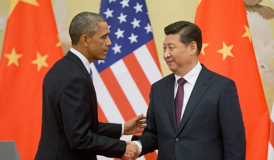 U.S. President Barack Obama, left, and Chinese President Xi Jinping shake hands following the conclusion of their joint news conference at the Great Hall of the People in Beijing, Wednesday, Nov. 12, 2014. (AP Photo/Pablo Martinez Monsivais) ** FILE **