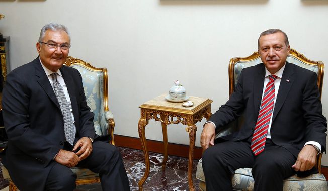 Deniz Baykal, former leader of the main opposition Republican People&#x27;s Party, left, and President Recep Tayyip Erdogan sit before a meeting in Ankara, Turkey, Wednesday, June 10, 2015. Opposition parties are likely to demand limits on President Recep Tayyip Erdogan&#x27;s role in Turkey&#x27;s next government, complicating coalition talks as the ruling party sought ways Tuesday to remain in power. Prime Minister Ahmet Davutoglu was to meet with Erdogan later Tuesday after their Justice and Development Party, or AKP, lost its parliamentary majority in Sunday&#x27;s vote. (AP Photo/Presidential Press Service, Pool)