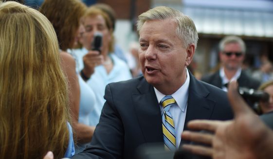 Sen. Lindsey Graham, South Carolina Republican and 2016 presidential hopeful, greets supporters in Central, S.C., on June 1, 2015. (Associated Press) **FILE**