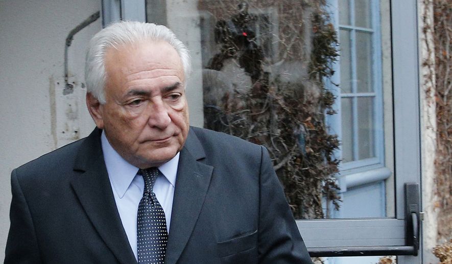 Former Managing Director of International Monetary Fund Dominique Strauss-Kahn leaves his hotel in Lille, northern France, as he goes on trial for sex charges at a court in this Feb. 11, 2015, file photo. (AP Photo/Christophe Ena, File)