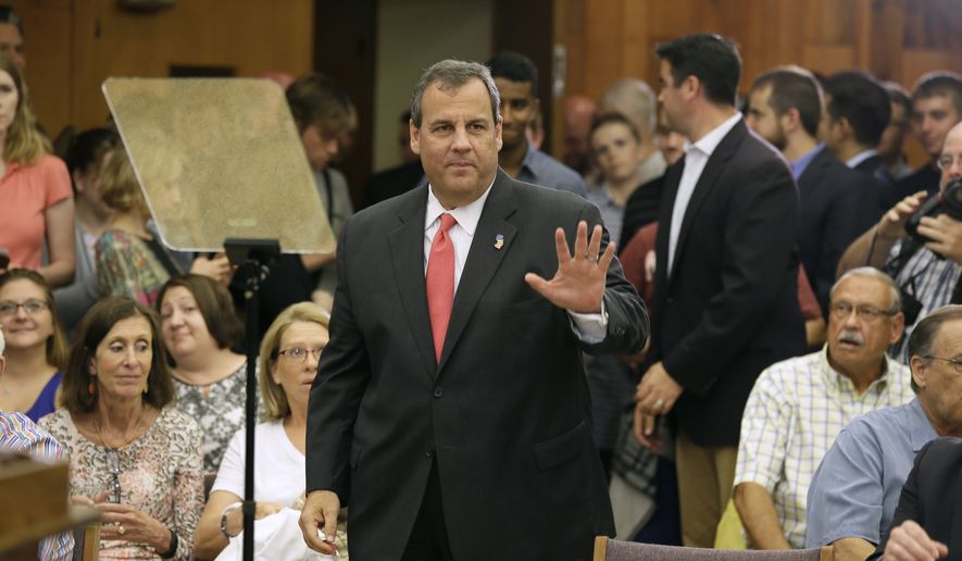 New Jersey Gov. Chris Christie waves to supporters before speaking about education reform, Thursday, June 11, 2015, at Iowa State University in Ames, Iowa. (AP Photo/Charlie Neibergall)