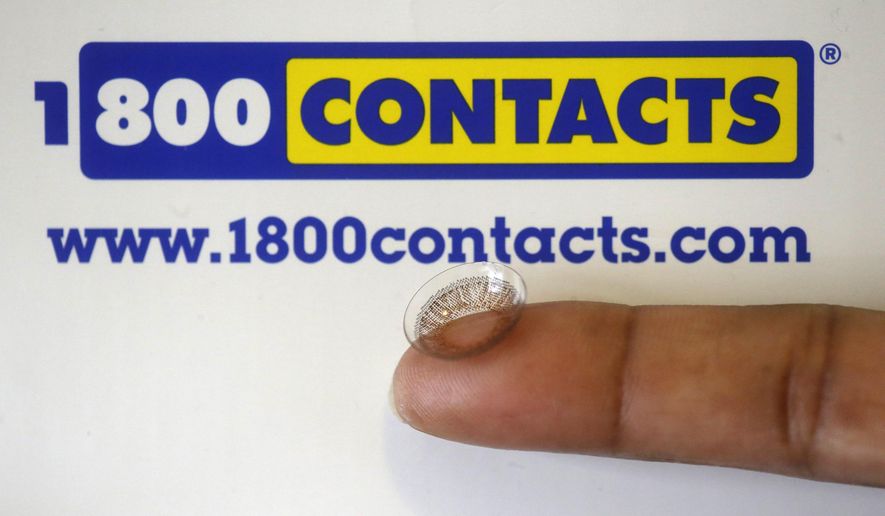 FILE - In this May 13, 2015 file photo, a contact lens is shown in front of a 1-800 Contacts shipping box in Salt Lake City. A federal appeals court will allow a hotly contested Utah law banning price fixing for contact lenses to go into effect.  The decision handed down Friday, June 12, 2015 from the 10th Circuit Court of Appeals in Denver comes after three of the nation&#39;s largest contact lens manufacturers sued to block the measure. The law could have wide-ranging effects on the roughly $4 billion contact lens market, which has some 38 million American consumers. (AP Photo/Rick Bowmer, File)