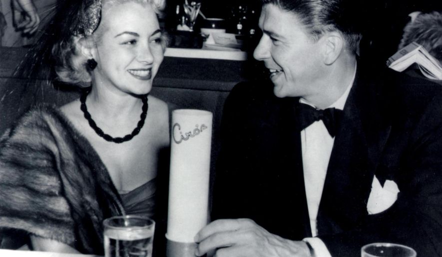 This undated photo provided by the Monica Lang Archive shows, actress Monica Lewis, left, and actor Ronald Reagan, at Ciro's in Los Angeles. The actress' former manager, Alan Eichler, says she died at age 93, on Friday, June 12, 2015, of natural causes at her home in the Los Angeles area. Lewis started her career as a vocalist with Benny Goodman's orchestra and went on to record several jazz hits in the 1940s, and in 1950, she hit Hollywood, signing an exclusive contract for music and movies with MGM. (Monica Lang Archive via AP)