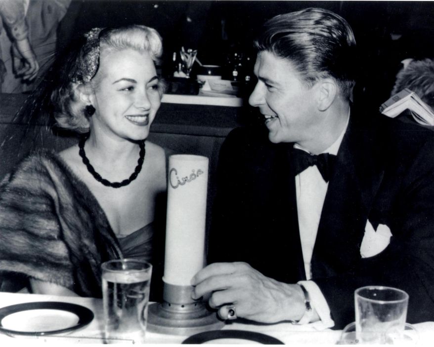 This undated photo provided by the Monica Lang Archive shows, actress Monica Lewis, left, and actor Ronald Reagan, at Ciro's in Los Angeles. The actress' former manager, Alan Eichler, says she died at age 93, on Friday, June 12, 2015, of natural causes at her home in the Los Angeles area. Lewis started her career as a vocalist with Benny Goodman's orchestra and went on to record several jazz hits in the 1940s, and in 1950, she hit Hollywood, signing an exclusive contract for music and movies with MGM. (Monica Lang Archive via AP)