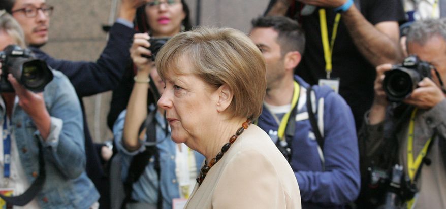 German Chancellor Angela Merkel arrives for the EU-CELAC summit in Brussels on Thursday, June 11, 2015. Greek Prime Minister Alexis Tsipras will continue his diplomatic offensive on Thursday to try to convince European creditors to pay out the bailout loans the country needs to avoid default. (AP Photo/Francois Walschaerts)