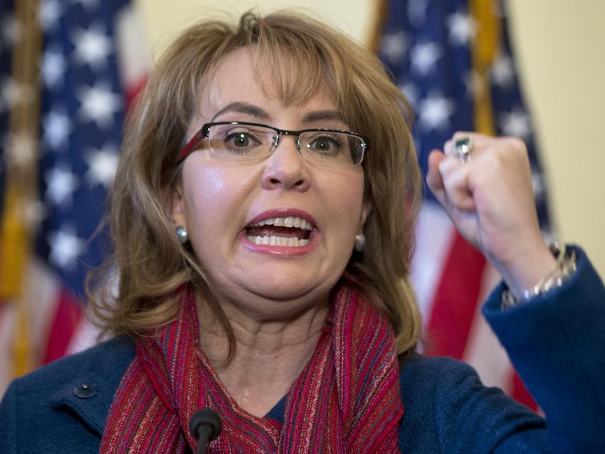 FILE - In this March 4, 2015, file photo, former U.S. Rep. Gabrielle &amp;quot;Gabby&amp;quot; Giffords of Arizona gestures as she speaks on Capitol Hill in Washington. Giffords is being recognized with a Navy ship named in her honor at a shipyard in Mobile, Alabama. Giffords is set to attend the Saturday, June 13, 2015,  christening of the USS Gabrielle Giffords.  (AP Photo/Carolyn Kaster, File)