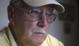 Retired Air Force reserve tech Sgt. Ed Kienle, 73, pauses during an interview at his home, Thursday, June 11, 2015, in Wilmington, Ohio. The government says U.S. Air Force reservists who became ill after being exposed to Agent Orange residue while working on planes after the Vietnam War would be eligible for disability benefits. (AP Photo/John Minchillo)
