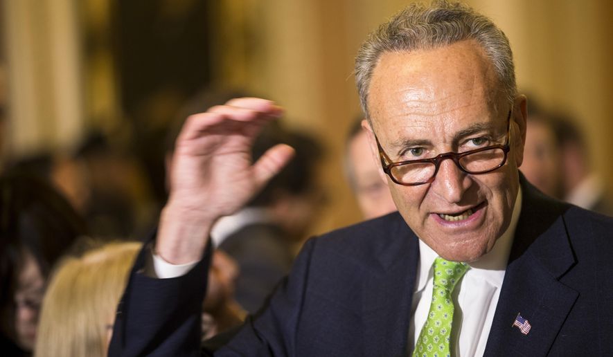 FILE - In this May 5, 2015, file photo, Sen. Charles Schumer, D-N.Y., speaks to reporters on Capitol Hill in Washington. Schumer wants airlines to scrap a proposal to reduce the allowed size of carry-on luggage. He planned a news conference Sunday, June 14, 2015, to warn travelers that a 20 percent reduction would force them to pay more for check-in fees or spend money on new luggage.  (AP Photo/Brett Carlsen, File)
