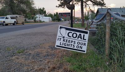 Pro-coal signs dot yards in Craig, Colorado, where residents are worried about the possible closing of the Colowyo mine in the wake of a WildEarth Guardians lawsuit and the loss of 220 jobs. (By Valerie Richardson/The Washington Times)