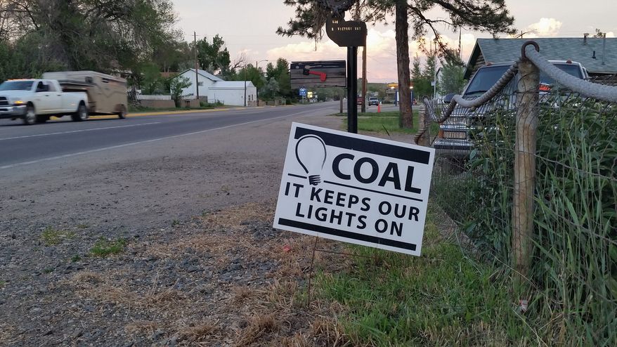 Pro-coal signs dot yards in Craig, Colorado, where residents are worried about the possible closing of the Colowyo Mine in the wake of a WildEarth Guardians lawsuit and the loss of 220 jobs. (By Valerie Richardson/The Washington Times) ** FILE **