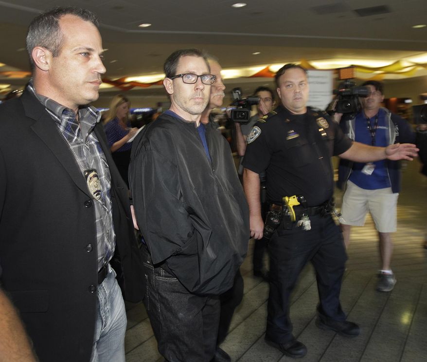 FILE - In a Oct. 15, 2014 file photo, Terry Speaks, center, a suspect in the 2012 stabbing and dismemberment of a Bourbon Street strip club dancer, arrives under heavy police guard at Louis Armstrong International Airport in Kenner, La. Trial is set to open Monday, June 15, 2015, for Speaks, accused of killing a New Orleans' French Quarter stripper in 2012, dismembering her and dumping body parts of the woman into the Gulf of Mexico. (Chris Granger/NOLA.com The Times-Picayune via AP, File) MAGS OUT; NO SALES; USA TODAY OUT; THE BATON ROUGE ADVOCATE OUT