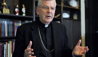 FILE - In this July 30, 2014, file photo, St. Paul-Minneapolis Archbishop John Nienstedt speaks at his office in St. Paul, Minn. On Monday, June 15, 2015, the Vatican said Pope Francis accepted the resignations of Nienstedt and Auxiliary Bishop Lee Anthony Piche after prosecutors charged the archdiocese with having failed to protect children from unspeakable harm from a pedophile priest. (AP Photo/Craig Lassig, File)